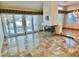 Spacious living room featuring elegant tile flooring and a cozy fireplace at 5010 Longboat Cir, Las Vegas, NV 89113