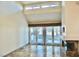 Bright and airy living room with large windows, stylish tile flooring, and a modern fireplace at 5010 Longboat Cir, Las Vegas, NV 89113
