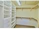 Organized walk-in closet featuring built-in shelving, drawers, and ample storage with hanging rods at 5010 Longboat Cir, Las Vegas, NV 89113
