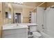 Bathroom with a shower-tub combo, white vanity, and tile flooring at 506 Staghorn Pass Ave, Las Vegas, NV 89183