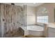 Beautiful bathroom featuring a glass shower, soaking tub, and modern fixtures at 506 Staghorn Pass Ave, Las Vegas, NV 89183