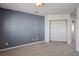 A bright bedroom is displayed with neutral carpet, a blank canvas, and space for creating your personal sanctuary at 506 Staghorn Pass Ave, Las Vegas, NV 89183