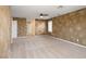 Spacious carpeted bonus room with decorative walls and adjacent rooms at 506 Staghorn Pass Ave, Las Vegas, NV 89183
