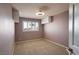 This bedroom features neutral carpet, a window with blinds, and integrated overhead storage at 506 Staghorn Pass Ave, Las Vegas, NV 89183
