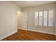 Bright bedroom features hardwood floors, natural light, and white trim at 506 Staghorn Pass Ave, Las Vegas, NV 89183
