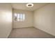 A cozy bedroom featuring plush carpeting and a bright window with shutter-style blinds at 506 Staghorn Pass Ave, Las Vegas, NV 89183