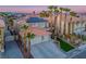 Spacious two-story home with solar panels, palm trees, well-maintained yard, and a large driveway at 506 Staghorn Pass Ave, Las Vegas, NV 89183