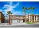 Inviting two-story home showcasing a tile roof, solar panels, a two-car garage, and lush landscaping at 506 Staghorn Pass Ave, Las Vegas, NV 89183