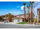 Charming two-story home with a tile roof, palm trees, and a well-manicured front yard at 506 Staghorn Pass Ave, Las Vegas, NV 89183