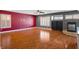 Open living room with hardwood floors, recessed lighting, a fireplace, and natural light at 506 Staghorn Pass Ave, Las Vegas, NV 89183