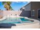 Private in-ground pool with desert landscaping, poolside statues and a beautiful blue water feature at 506 Staghorn Pass Ave, Las Vegas, NV 89183
