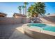Backyard showcasing a private in-ground pool, desert landscaping and tiled patio area at 506 Staghorn Pass Ave, Las Vegas, NV 89183