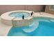 Inviting private in-ground pool with hot tub and waterfall feature, surrounded by tiled coping at 506 Staghorn Pass Ave, Las Vegas, NV 89183