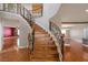 Elegant wooden staircase with decorative iron railing and views of the hardwood floors at 506 Staghorn Pass Ave, Las Vegas, NV 89183