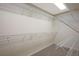 Walk-in closet with carpeted floors and multiple shelves to store your clothing and accessories at 506 Staghorn Pass Ave, Las Vegas, NV 89183