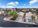 Residential neighborhood with landscaped yards and a well-maintained street under a partly cloudy sky at 5107 Morning Splash Ave, Las Vegas, NV 89131