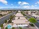 Aerial view of the property with a large RV, sparkling pool, and easy access to main roads at 5107 Morning Splash Ave, Las Vegas, NV 89131