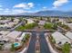 A nice aerial shot of the entryway to the community with lush landscaping and well-maintained streets at 5107 Morning Splash Ave, Las Vegas, NV 89131