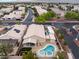 Expansive aerial view of home featuring a backyard pool, patio, and RV parking in a gated community at 5107 Morning Splash Ave, Las Vegas, NV 89131