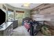 A cozy bedroom with wood paneled accent wall, dresser, and a ceiling fan at 5107 Morning Splash Ave, Las Vegas, NV 89131