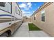 Spacious driveway with RV parking, leading to a well-maintained home and backyard at 5107 Morning Splash Ave, Las Vegas, NV 89131