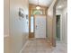 Bright entryway featuring neutral walls, tile flooring, and a white front door with transom window above at 5107 Morning Splash Ave, Las Vegas, NV 89131