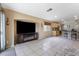 Living room features a fireplace, large television, and access to the kitchen and breakfast area at 5107 Morning Splash Ave, Las Vegas, NV 89131