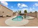 Inviting in-ground pool and spa surrounded by a well-maintained patio and landscaped yard at 5107 Morning Splash Ave, Las Vegas, NV 89131