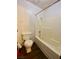 Bathroom featuring combination shower-tub and toilet with wood look flooring at 5245 Golden Ln, Las Vegas, NV 89119