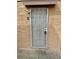 View of a door with security screen and the apartment unit number, 13, on the wall at 5245 Golden Ln, Las Vegas, NV 89119