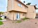 Back of condo with a compact backyard and neutral stucco, offering a blank canvas at 5245 Golden Ln, Las Vegas, NV 89119