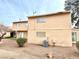 Condo exterior with a neat lawn, offering a blend of privacy and community living at 5245 Golden Ln, Las Vegas, NV 89119