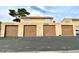 View of the garages with a two story apartment above, showing the front of the complex at 5245 Golden Ln, Las Vegas, NV 89119