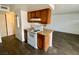 A view of the kitchen featuring an electric range oven with wooden cabinets above at 5245 Golden Ln, Las Vegas, NV 89119