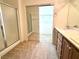 Bathroom featuring double sinks, a glass shower door, and a large walk-in closet at 5327 Progresso St, Las Vegas, NV 89135