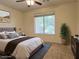 Cozy bedroom with plush bedding, natural light from the large window, and calming decor at 5327 Progresso St, Las Vegas, NV 89135