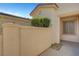 Private courtyard with stucco walls and mature landscaping offers a tranquil outdoor space at 5327 Progresso St, Las Vegas, NV 89135