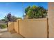 Private courtyard with stucco walls and mature landscaping offers a tranquil outdoor space at 5327 Progresso St, Las Vegas, NV 89135