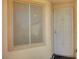 Close up of home entrance featuring neutral colors, a window and security door at 5327 Progresso St, Las Vegas, NV 89135