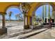 Welcoming entrance with stone columns that lead to a meticulously landscaped courtyard and tranquil fountain at 5327 Progresso St, Las Vegas, NV 89135
