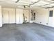 Spacious two-car garage with epoxy floor, storage cabinets, and ample lighting at 5327 Progresso St, Las Vegas, NV 89135