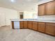 Kitchen features a large sink, wooden cabinets and a dishwasher at 5327 Progresso St, Las Vegas, NV 89135