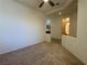 Cozy living room nook with a ceiling fan and a small window, carpeted floor at 5327 Progresso St, Las Vegas, NV 89135