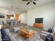 Open-concept living room and dining area features modern furnishings and neutral tones for a welcoming atmosphere at 5327 Progresso St, Las Vegas, NV 89135