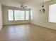 Bright living room with tile floors, many windows, and modern light fixture at 5327 Progresso St, Las Vegas, NV 89135