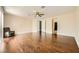Large primary bedroom boasting hardwood floors, a ceiling fan, and easy access to adjoining rooms at 5337 Polizze Ave, Las Vegas, NV 89141