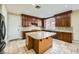 Gourmet kitchen boasts granite countertops, an island, and stainless steel appliances for modern living at 5337 Polizze Ave, Las Vegas, NV 89141
