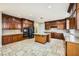 Well-equipped kitchen featuring custom cabinetry, granite countertops, and a practical center island at 5337 Polizze Ave, Las Vegas, NV 89141