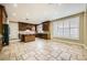 Open concept kitchen with granite countertops, a large center island, and lots of cabinet space at 5337 Polizze Ave, Las Vegas, NV 89141