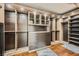 Custom walk-in closet with built-in shelving, drawers, and ample storage space in a naturally lit space at 5337 Polizze Ave, Las Vegas, NV 89141